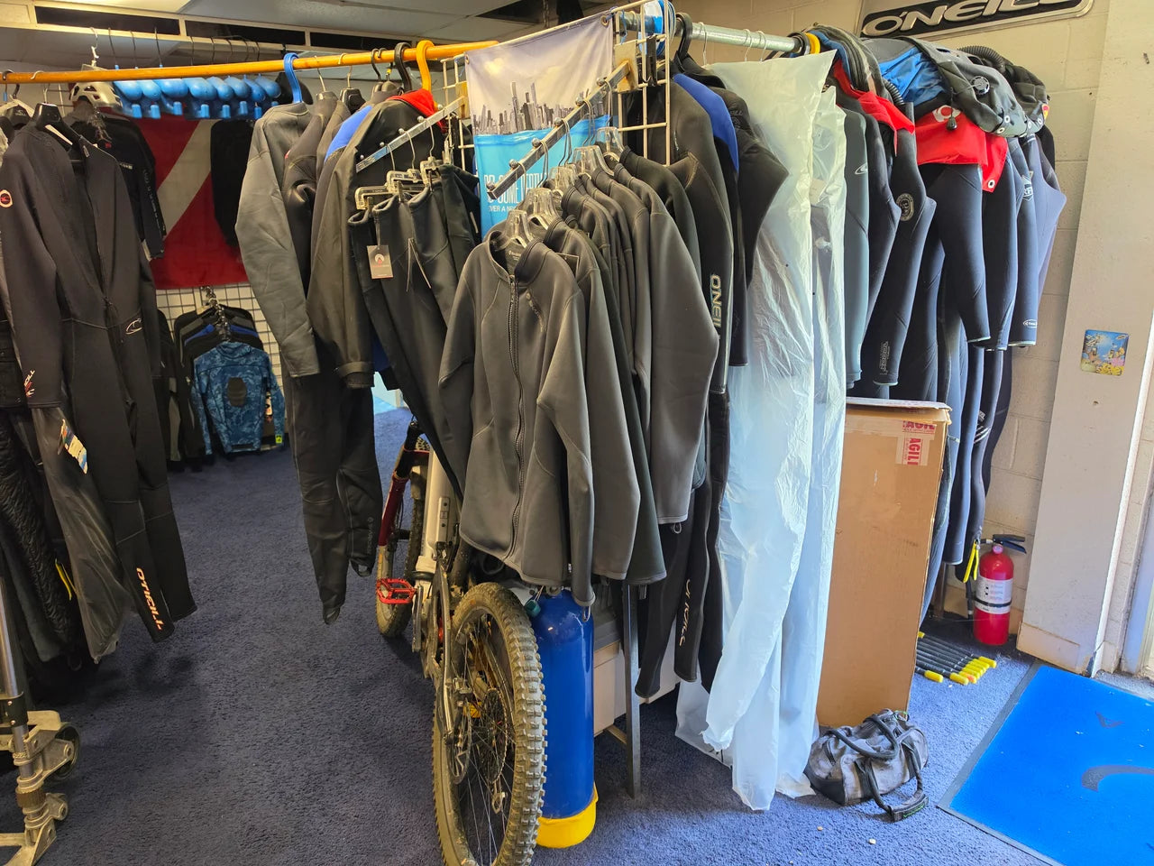 Exposure suits on the shop clothing racks
