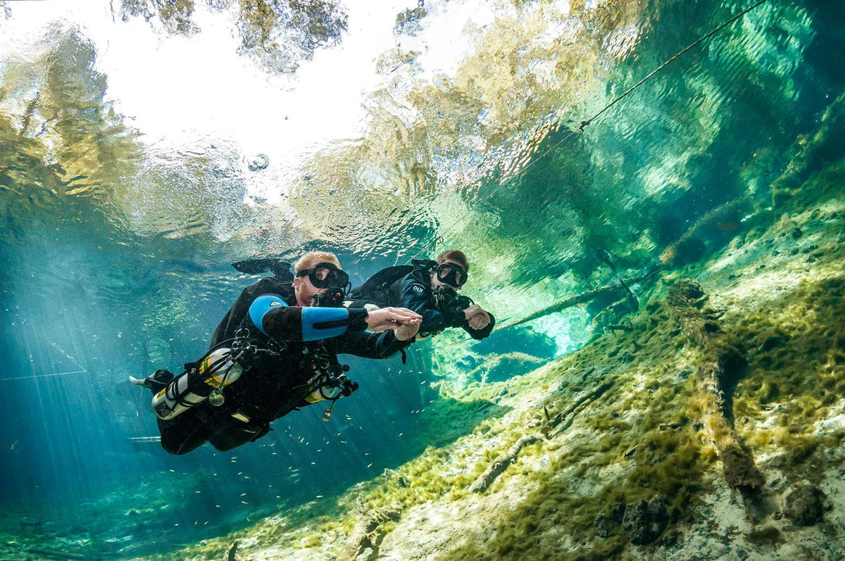 A sidemount diver moves through open water. © PADI 2013
