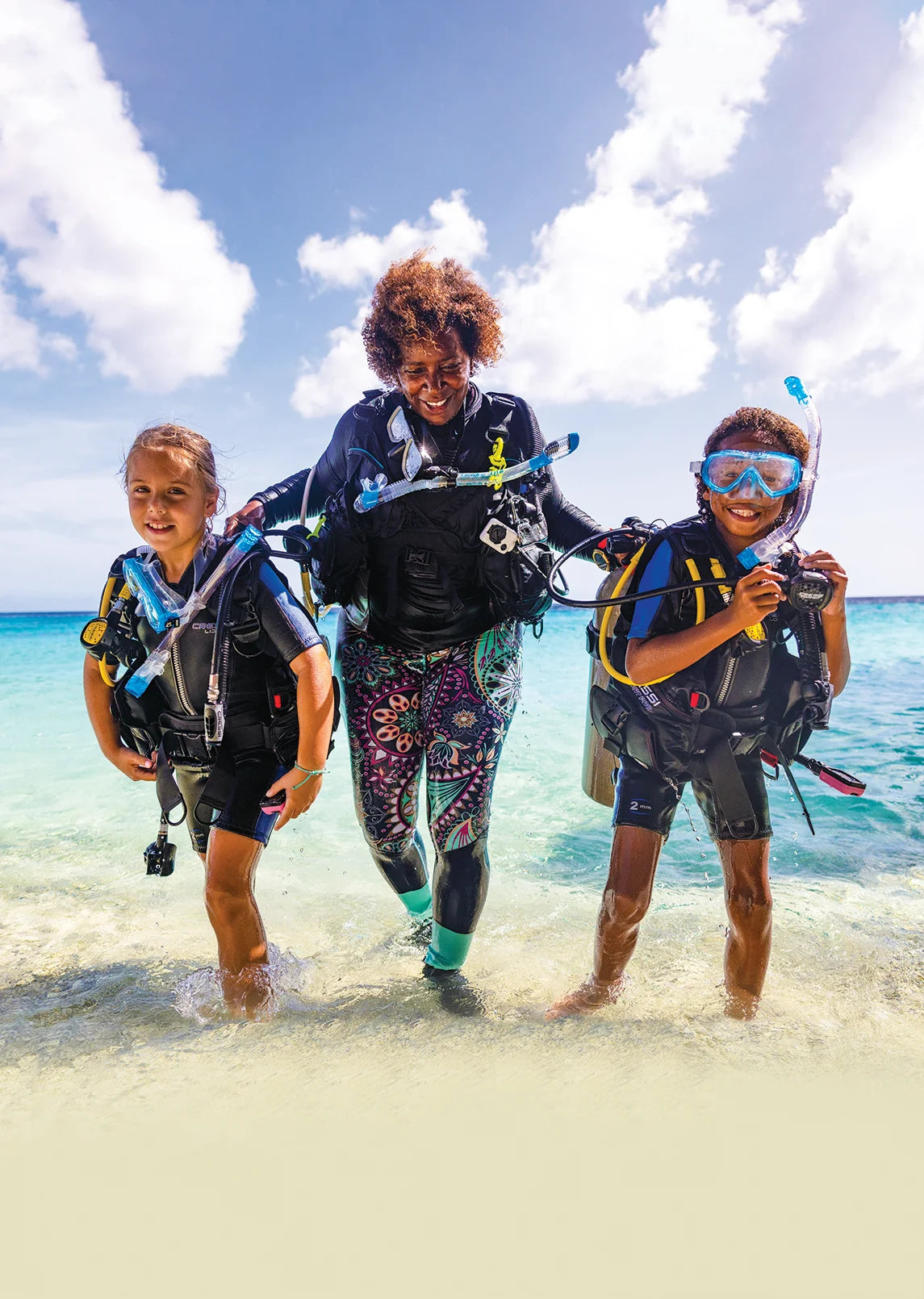 Children prepare to enter the water with a PADI professional.
